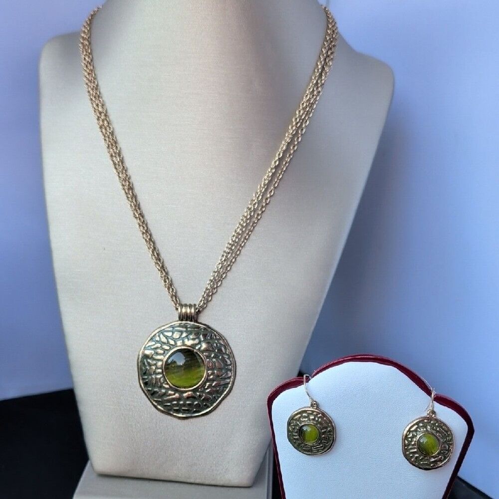 vintage Whiting & Davis jewelry set featuring a gold-toned & Green Stones.